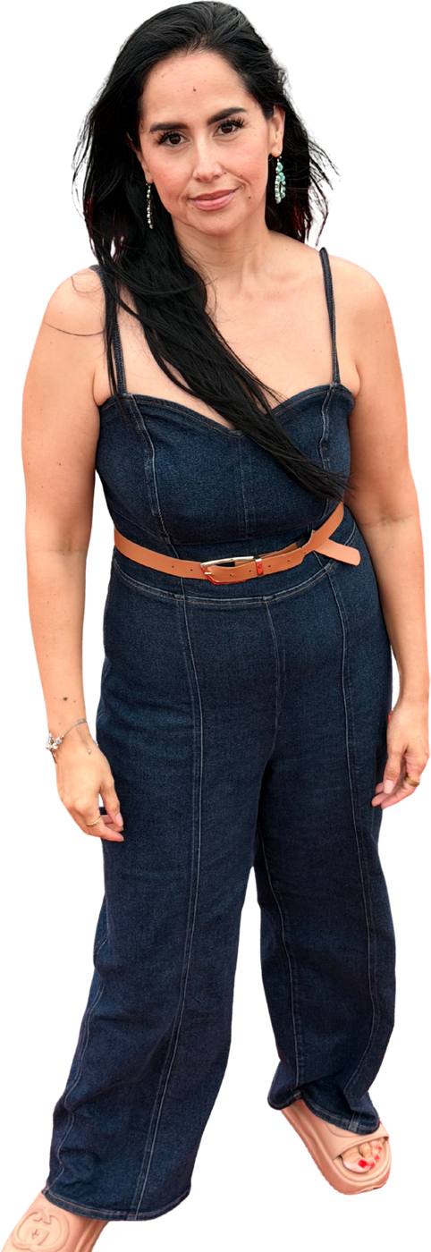 Dra. Amanda Perez standing in a denim jumpsuit